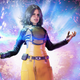 Marvel Avengers' Monica, and her magical glowy cube, in from of explody special effects.